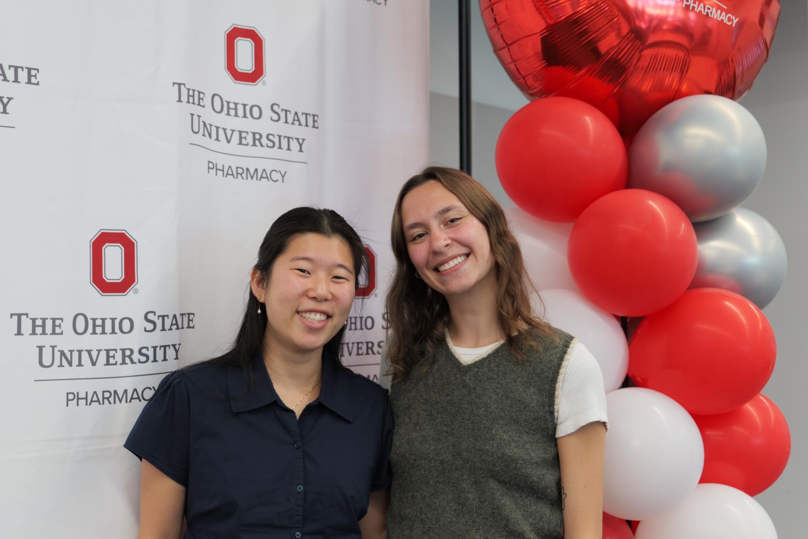 Two students smiling 