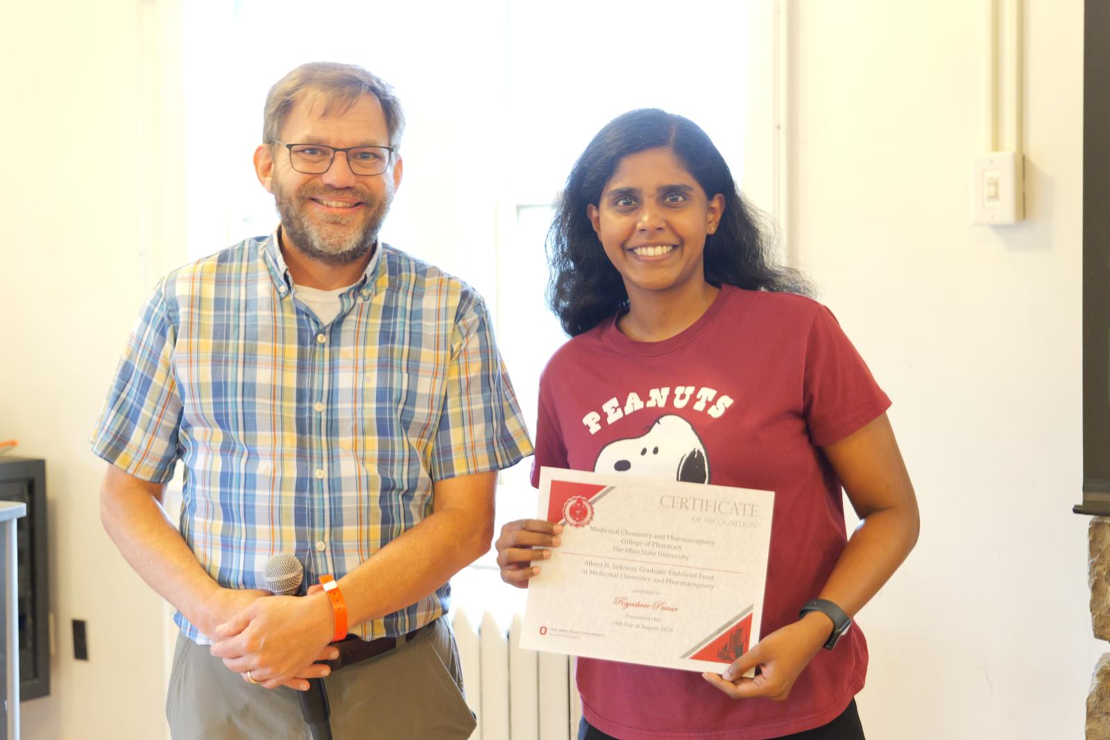 Rajashree holding her award