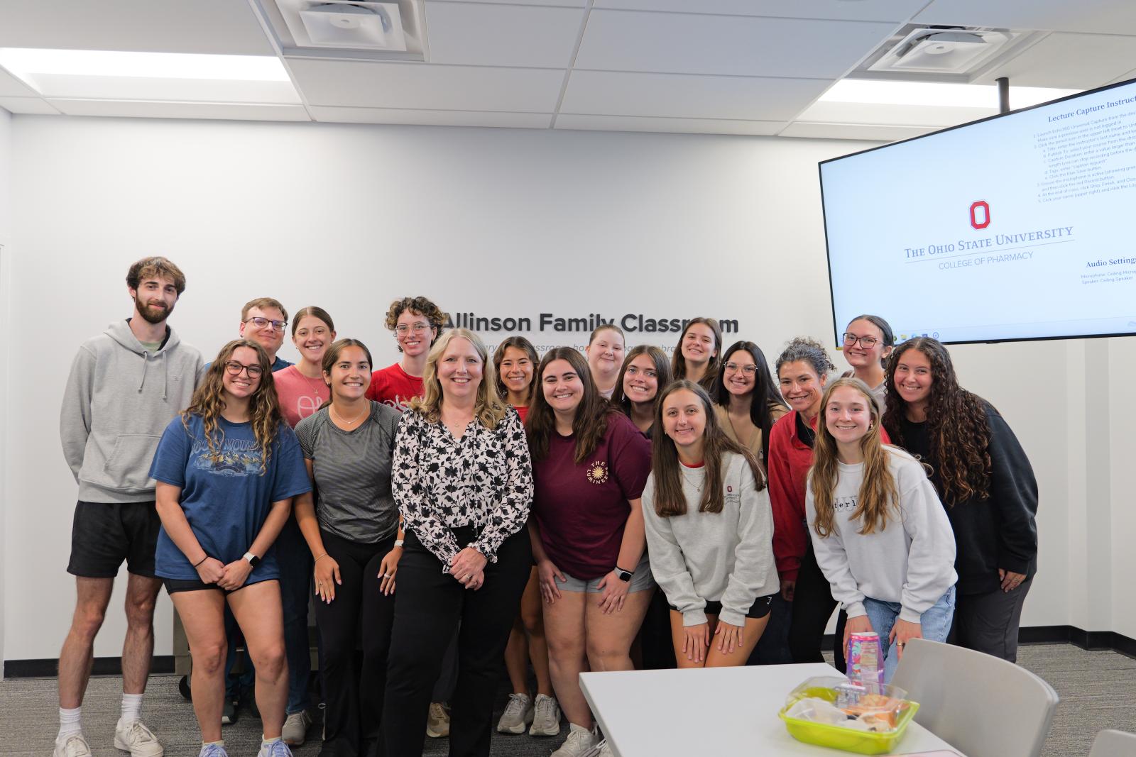 A group of students smiling with Dr. Barnes