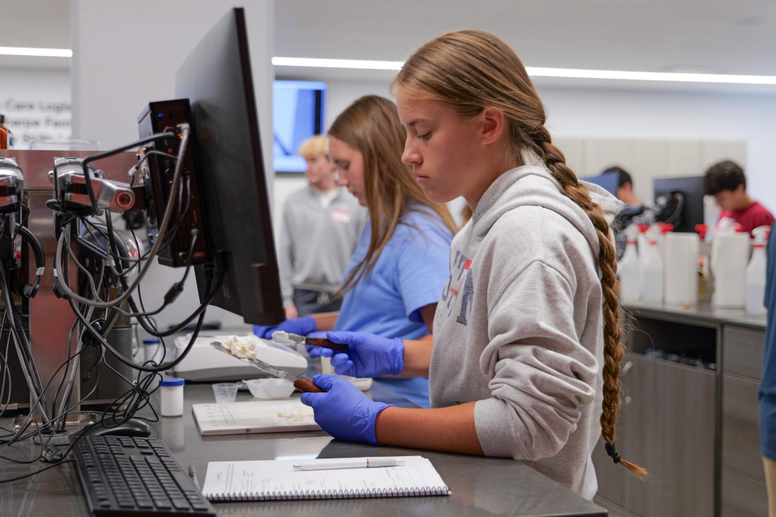 Student working at compounding bench