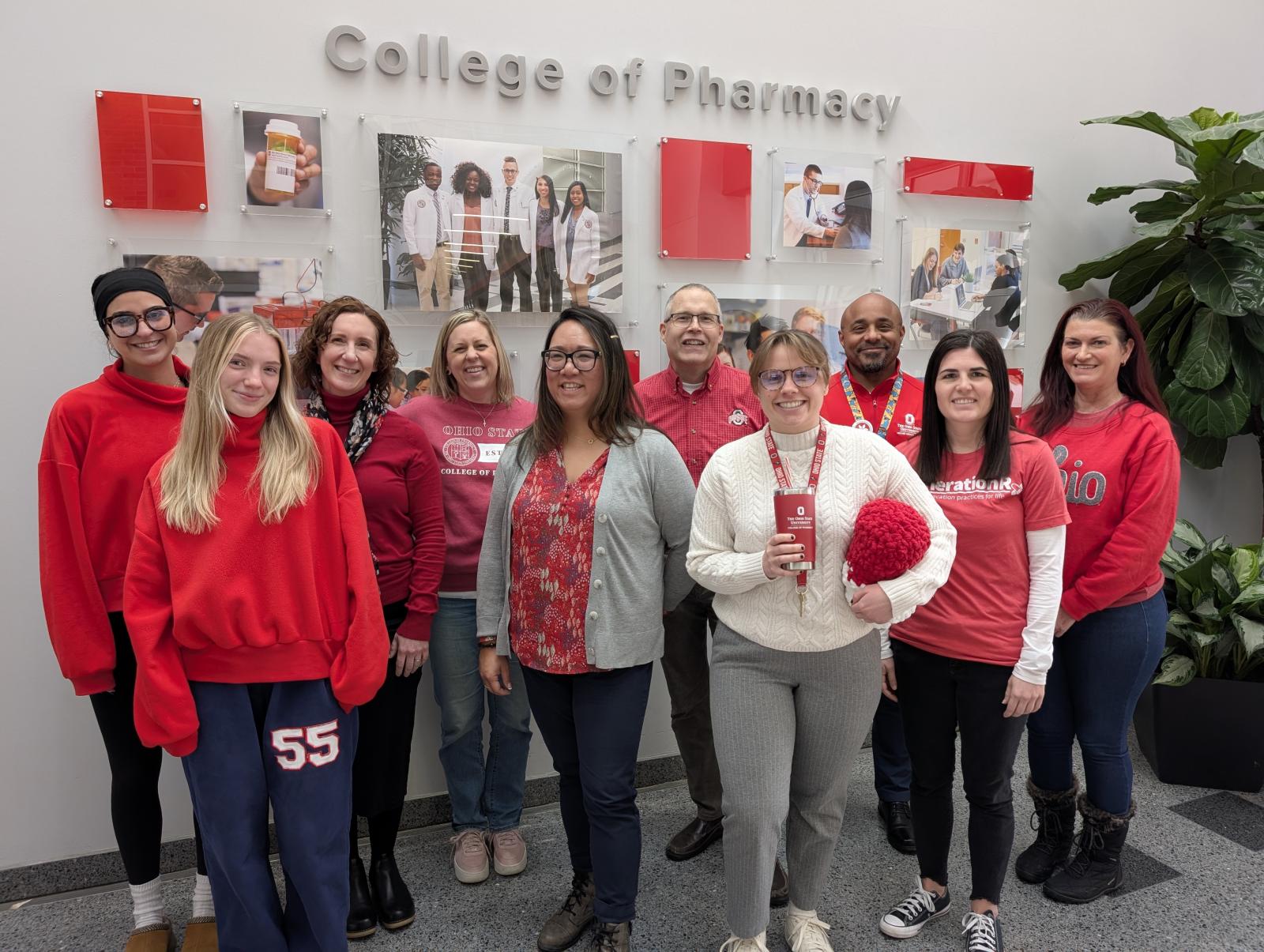 Group photo of COP members wearing red.