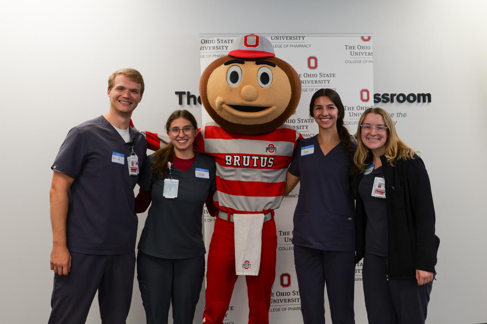 Group photo of new students with Brutus