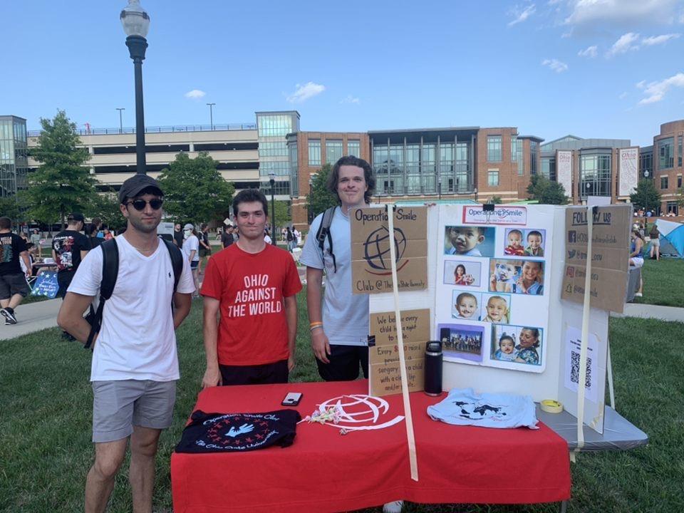 Richlak (right) and other Ohio State Operation Smile Club members teaching campus about the club