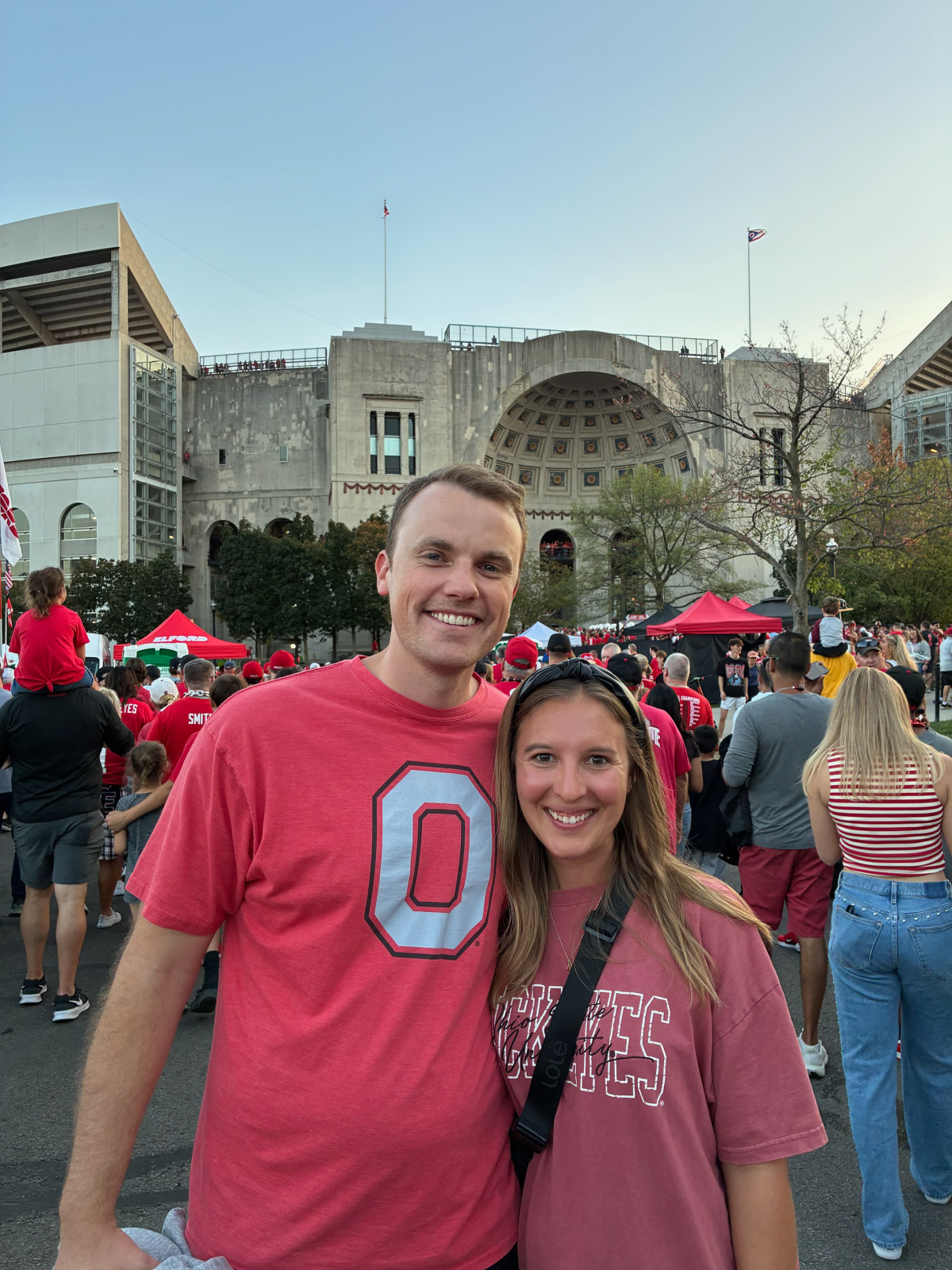 Mark Doles with a woman wearing Ohio State shirts. 