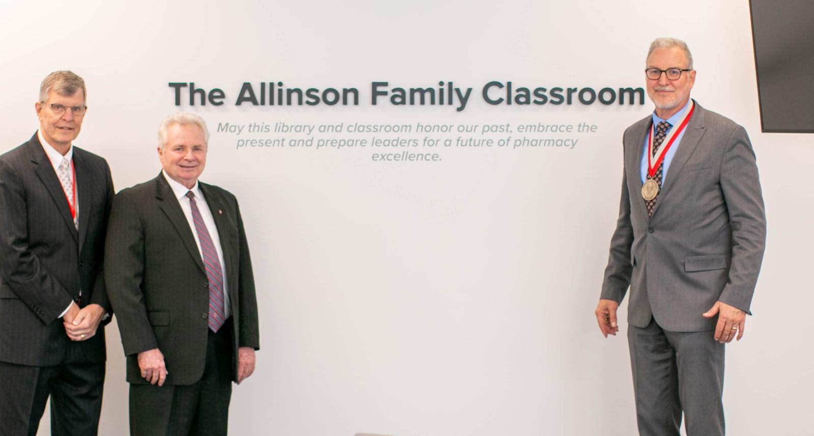 Allinson, Mann and Weber standing in front of the new "Allinson Suite" sign