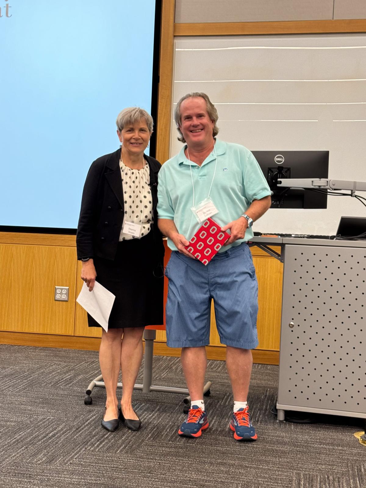 Dr. Sullivan receives the P1 Teaching Award from Dean Deanna Kroetz