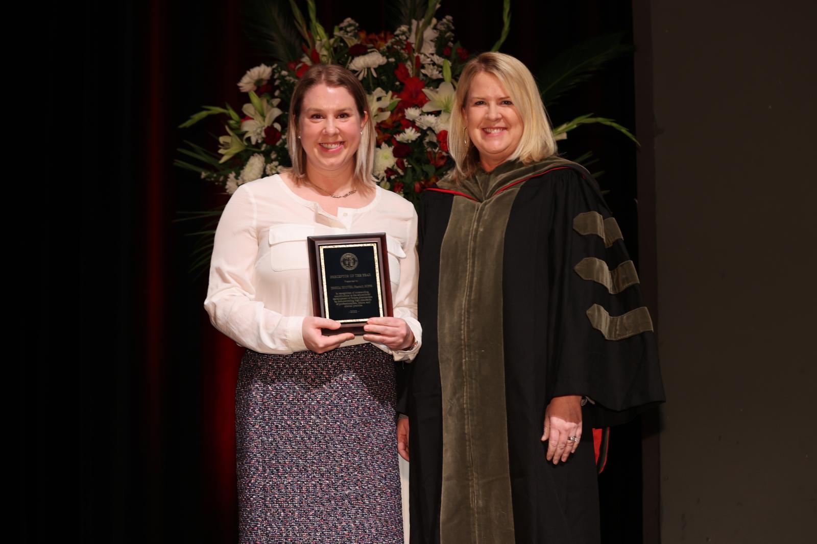 Dr. Hoover receiving the Preceptor of the Year award, next to Julie Legg, PharmD, Director of Experiential Education