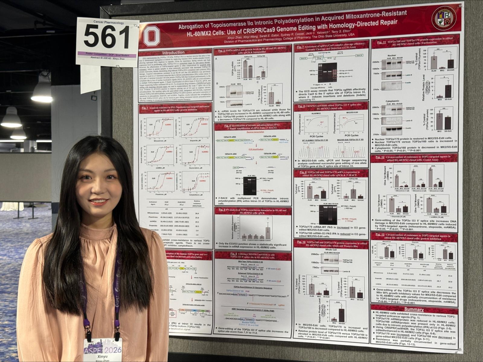 Zhao in front of her poster presentation