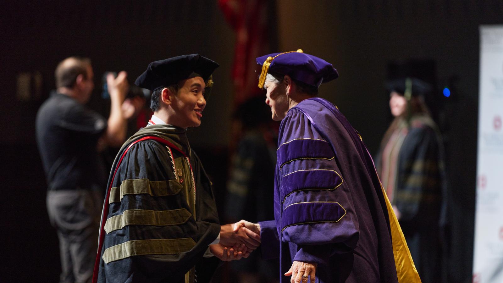 Dr. Gao at the 2024 PharmD Hooding Ceremony