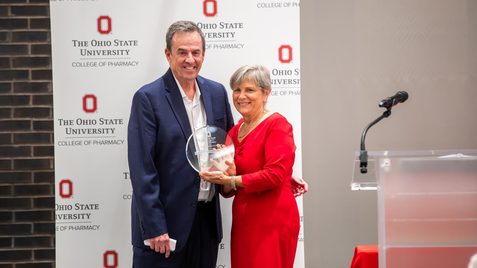 Bill Miller accepting his award from Dean Kroetz