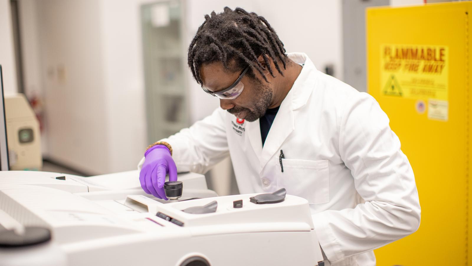 Dr. Adu-Ampratwum working in he Fuchs Lab