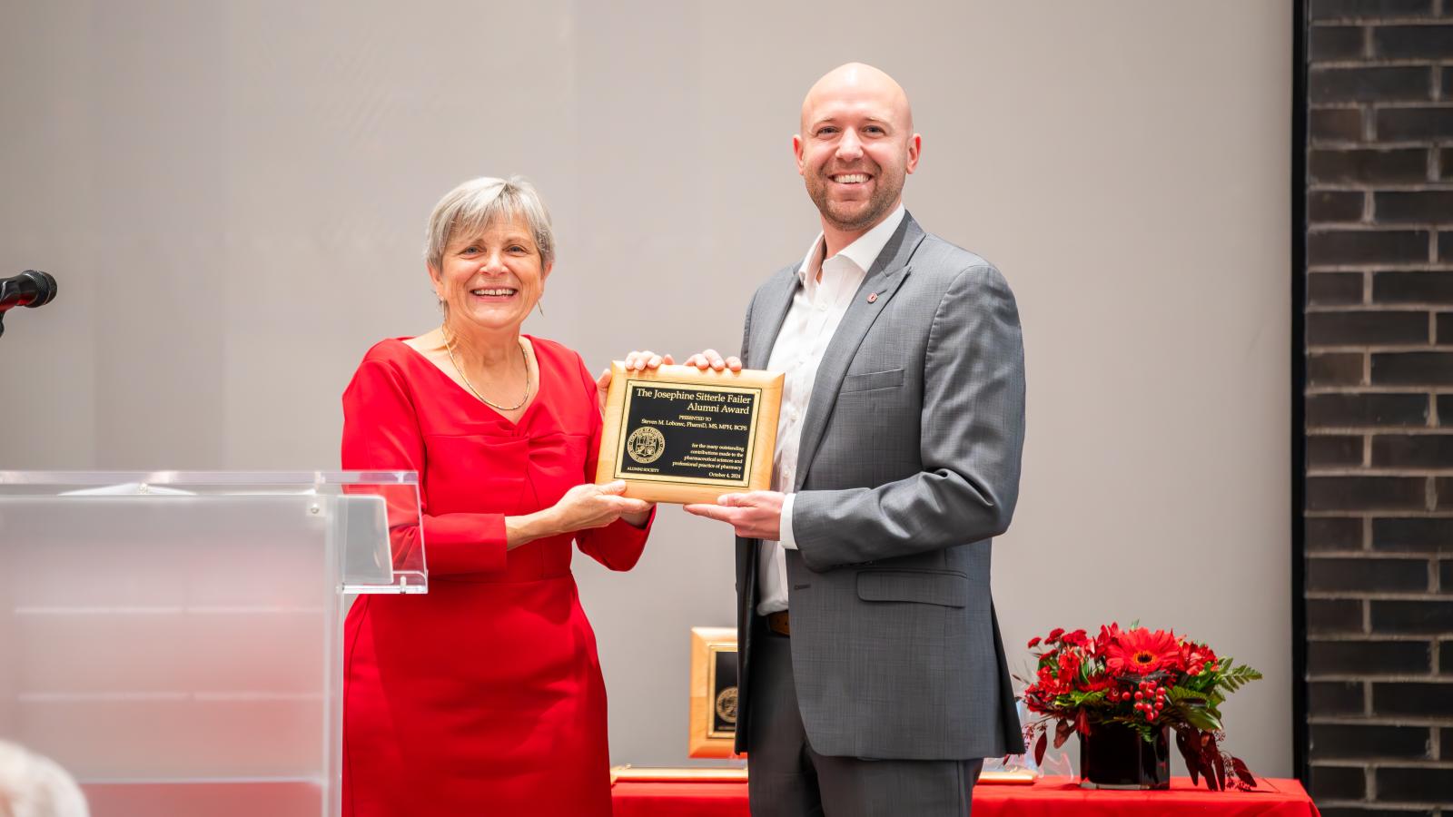 Steven Loborec accepting award