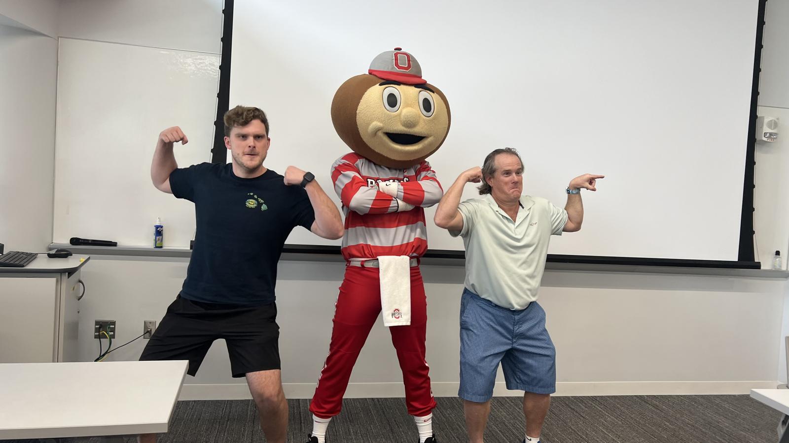 Dr. Sullivan, Brutus and student at exam photo op