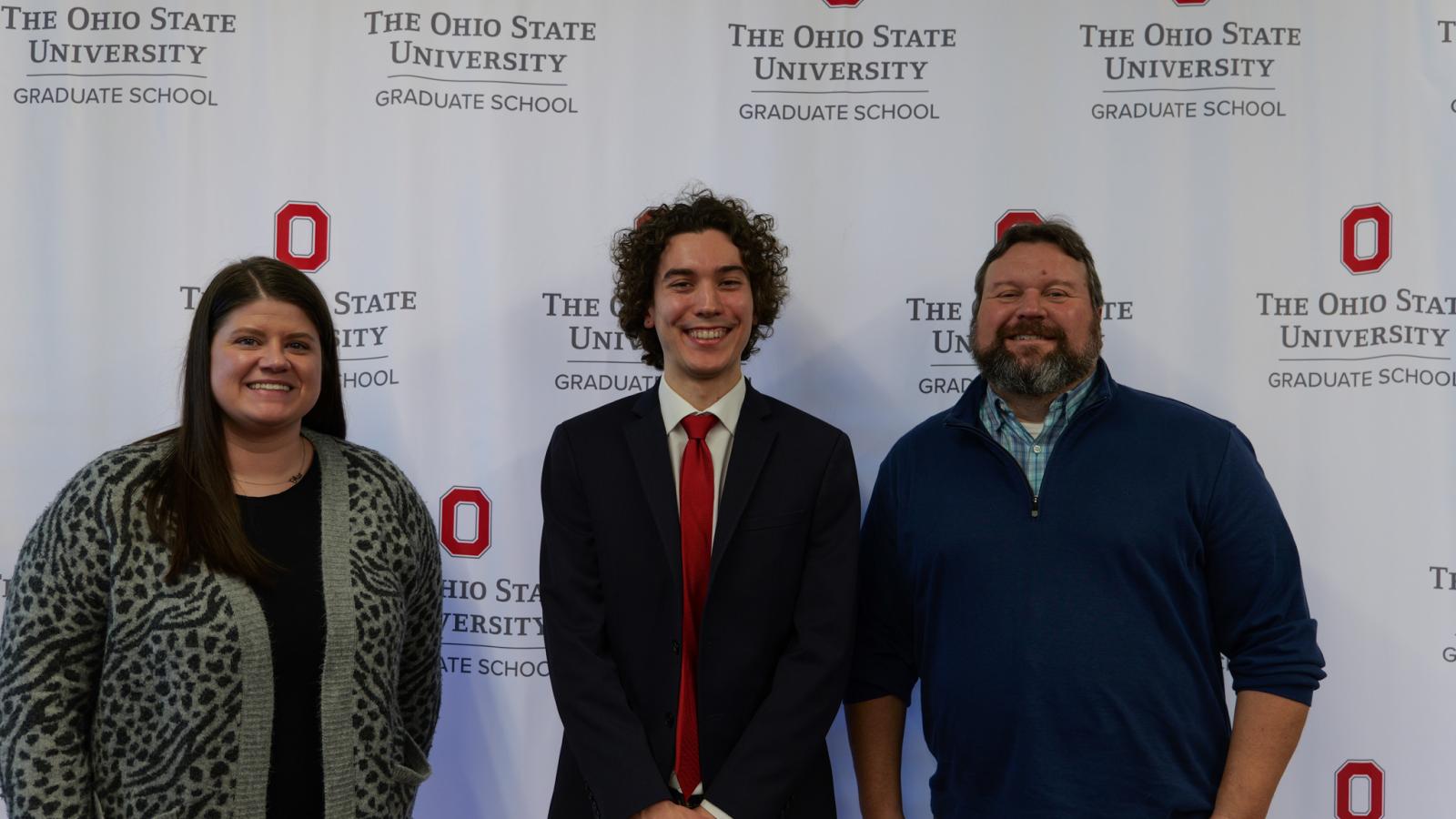 Jessica Costic, Isaac Karel and Jim Fuchs at the 3MT Competition