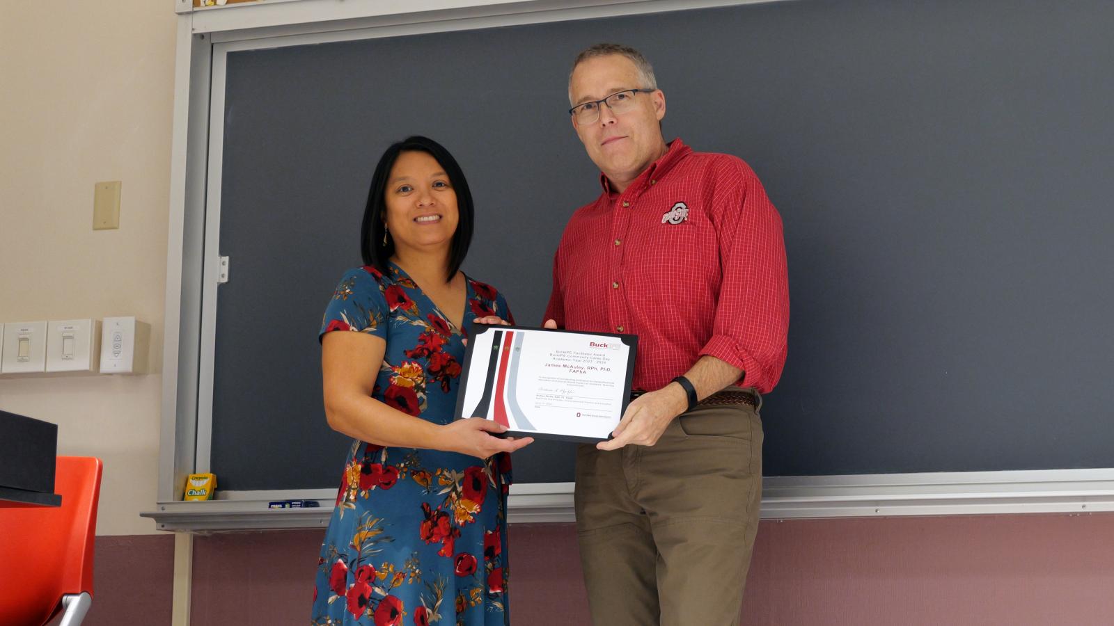 Jim McAuley receiving IPE award