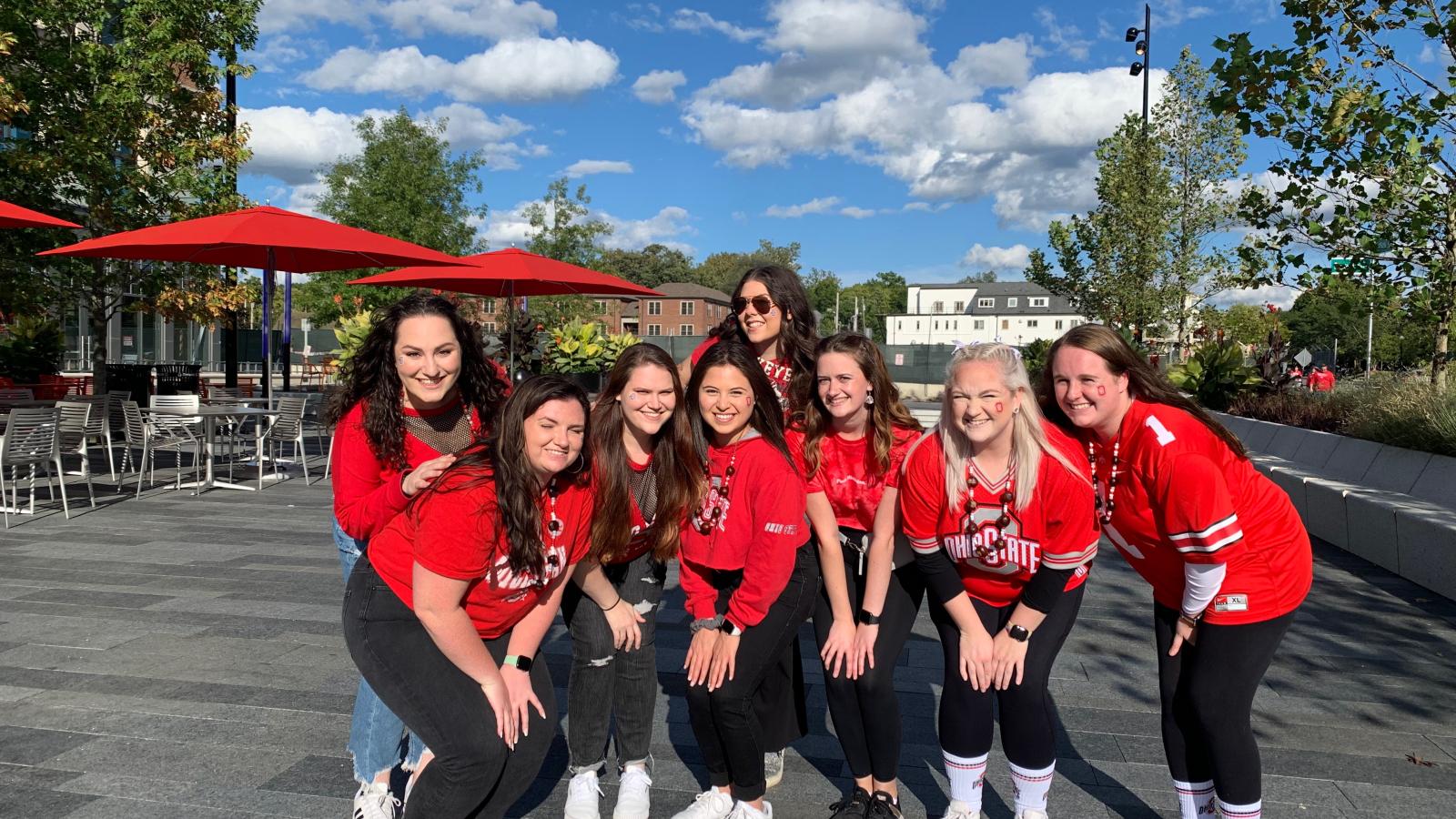 Julia Miller, center, with her friends before a football game