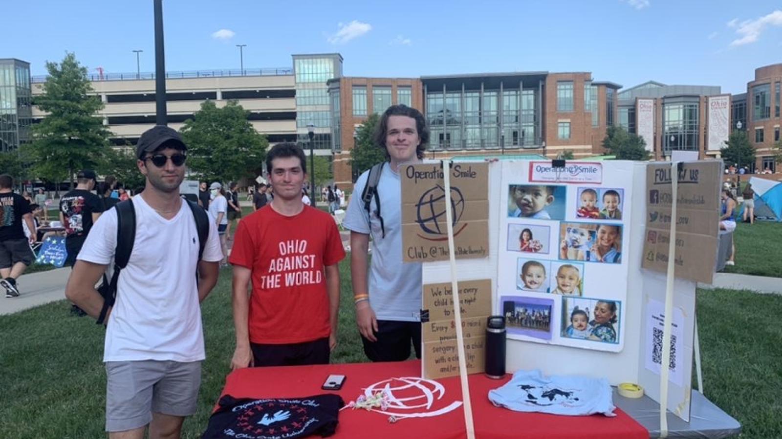 Richlak (right) and other Ohio State Operation Smile Club members teaching campus about the club