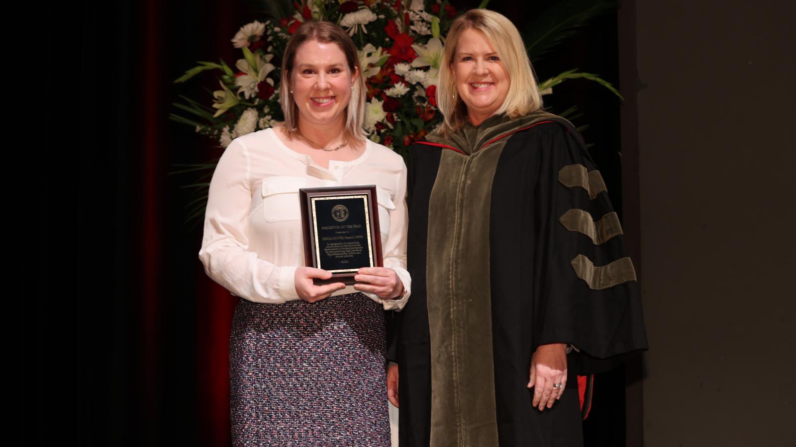 Dr. Hoover receiving the Preceptor of the Year award, next to Julie Legg, PharmD, Director of Experiential Education