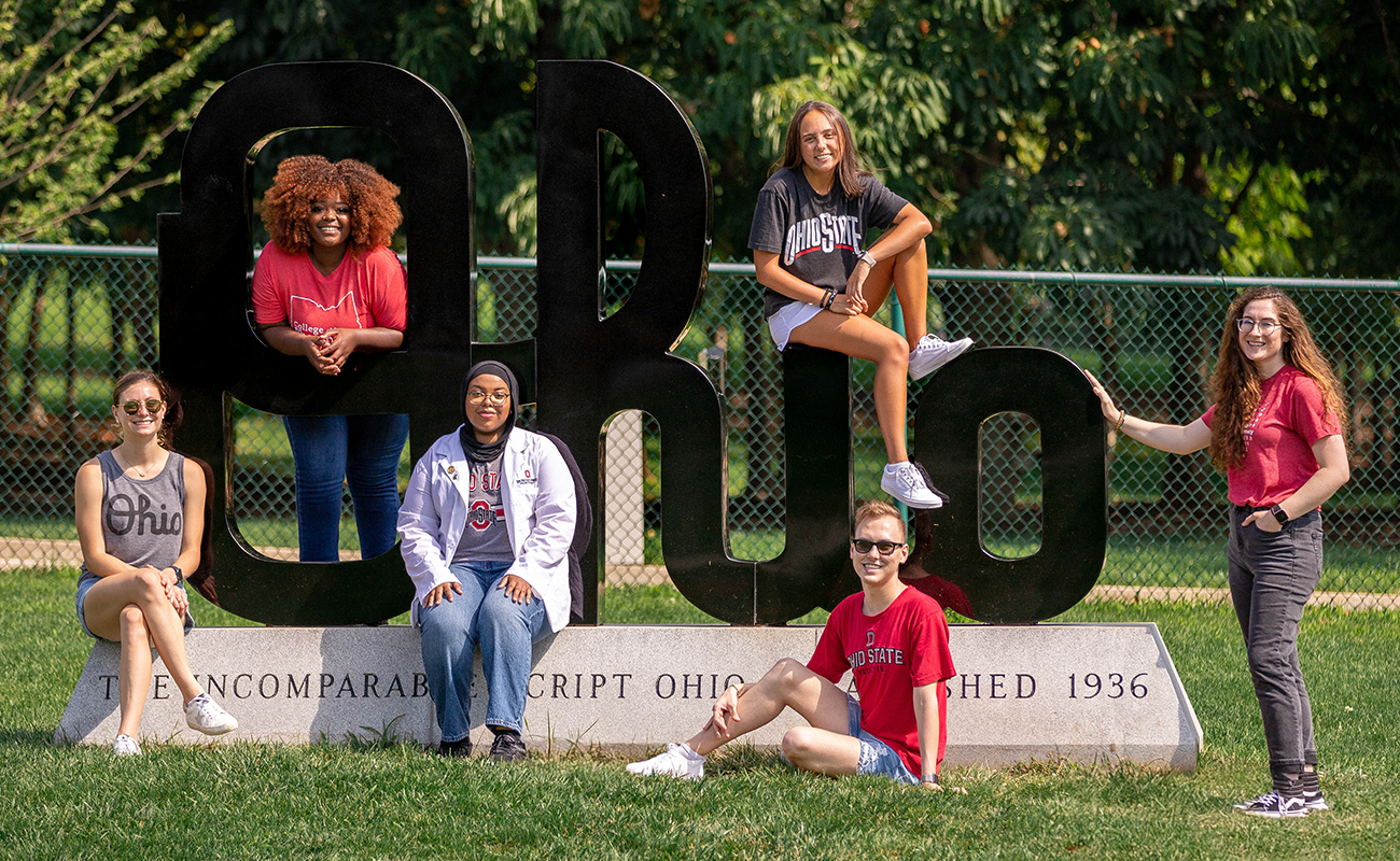 Image of several pharmacy students with the 'Ohio' statue