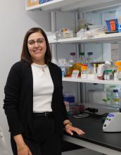 Nadeen Anabtawi standing by a lab bench