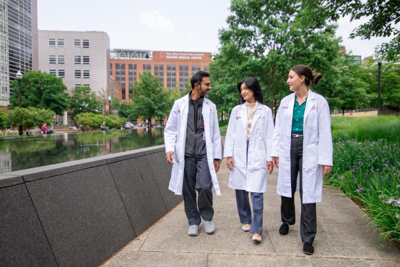 three pharmacists walk in front of wexner medical center