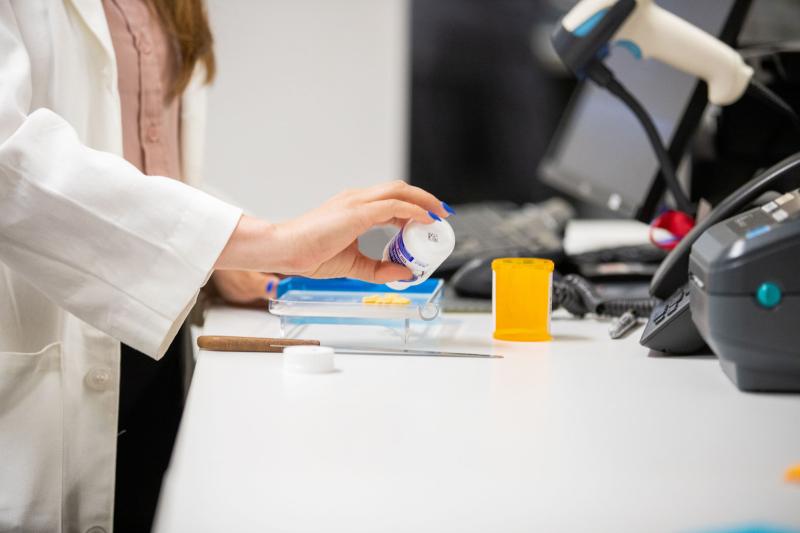 a pharmacist dispending medication