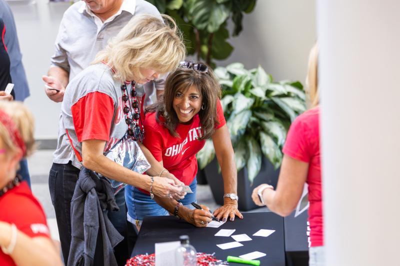 two people at a registration table