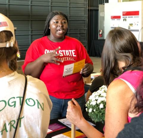 Second-year PharmD student Camelia Youayou speaks with FSR attendees