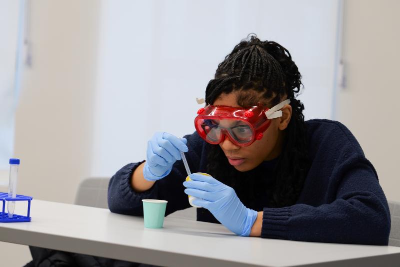 Student completing DNA experiment