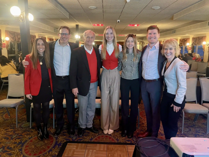 a group of people posing for photo