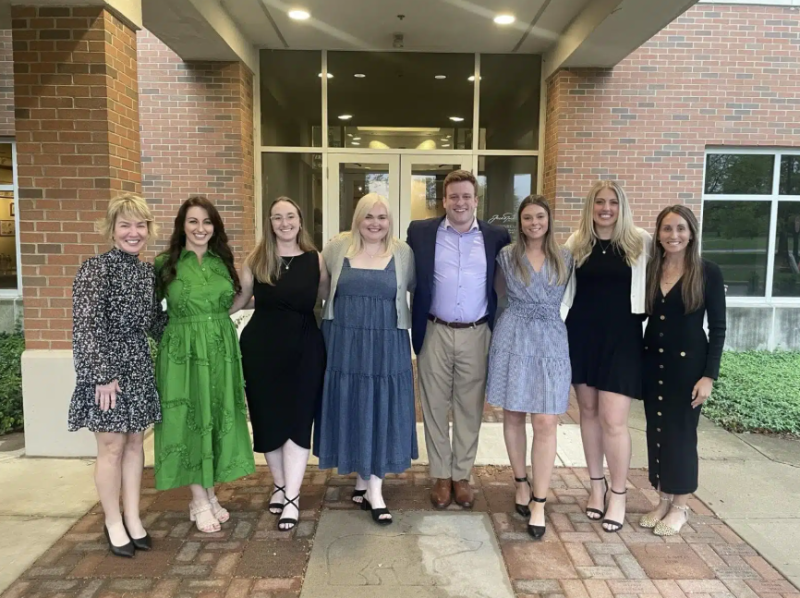 a group of people posing for a photo