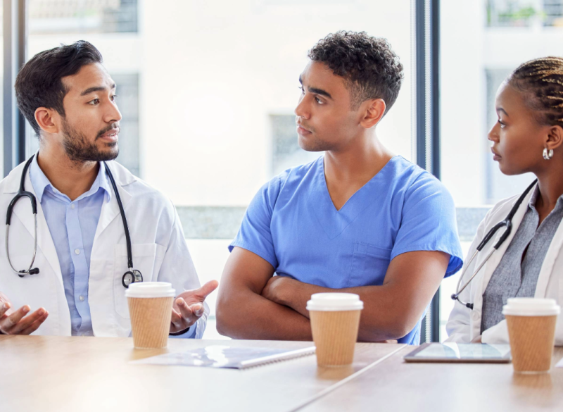 Image of students sitting around enjoying coffee and conversing