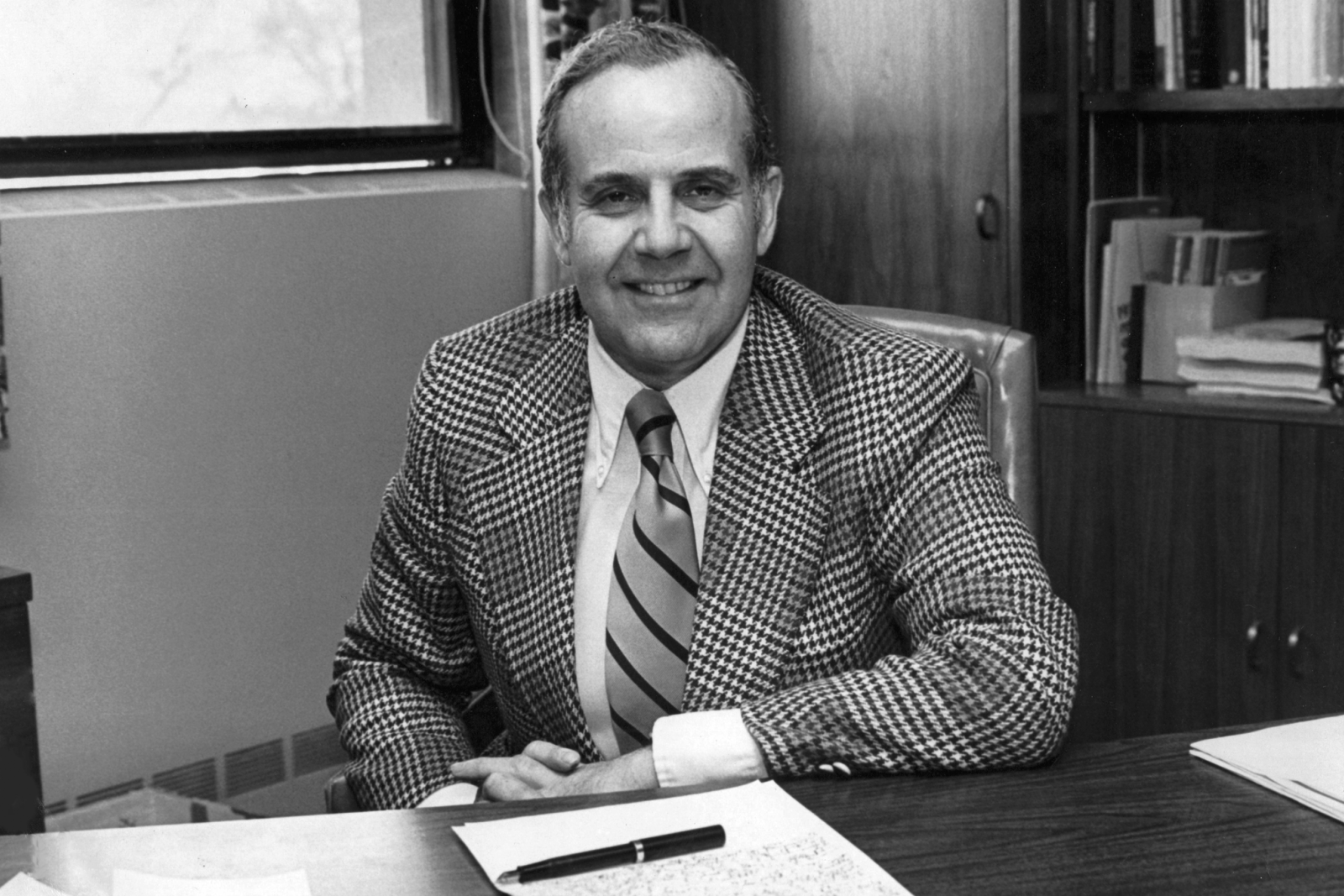 Dean Albert Soloway sitting at his desk in 1978