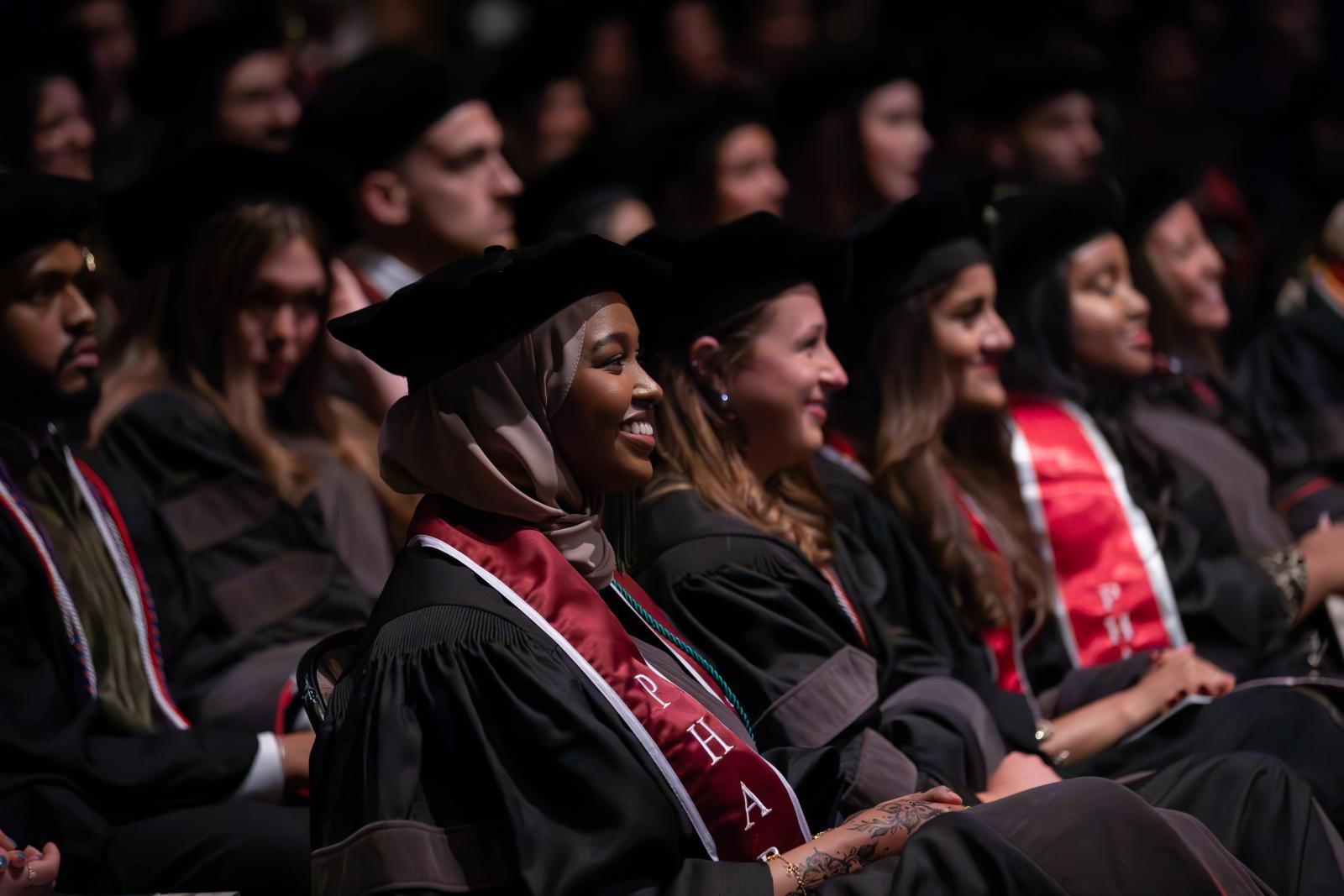 Students sitting at 2025 Hooding Ceremony
