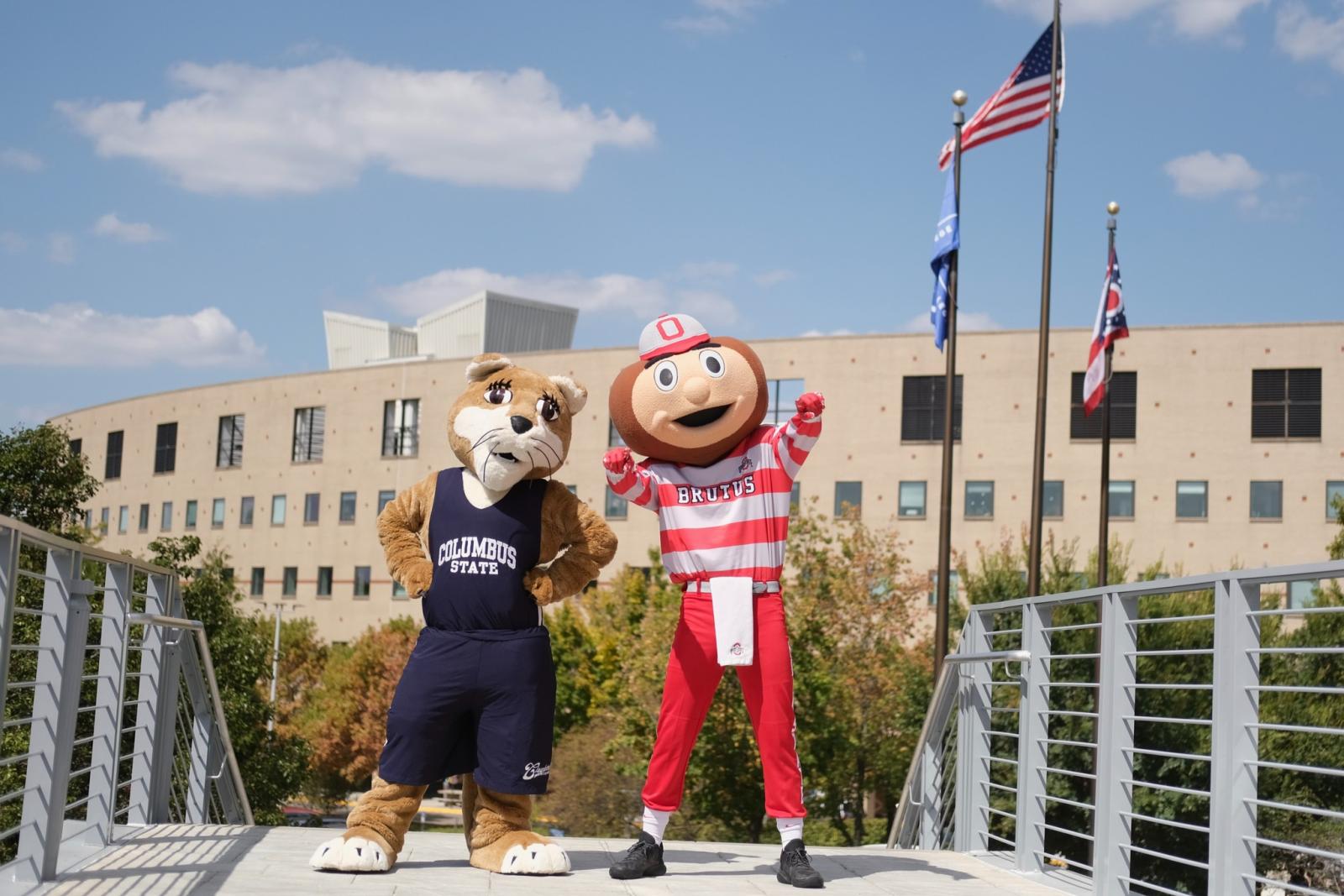 Brutus Buckeye and Columbus State Cougar mascot standing on Columbus State campus