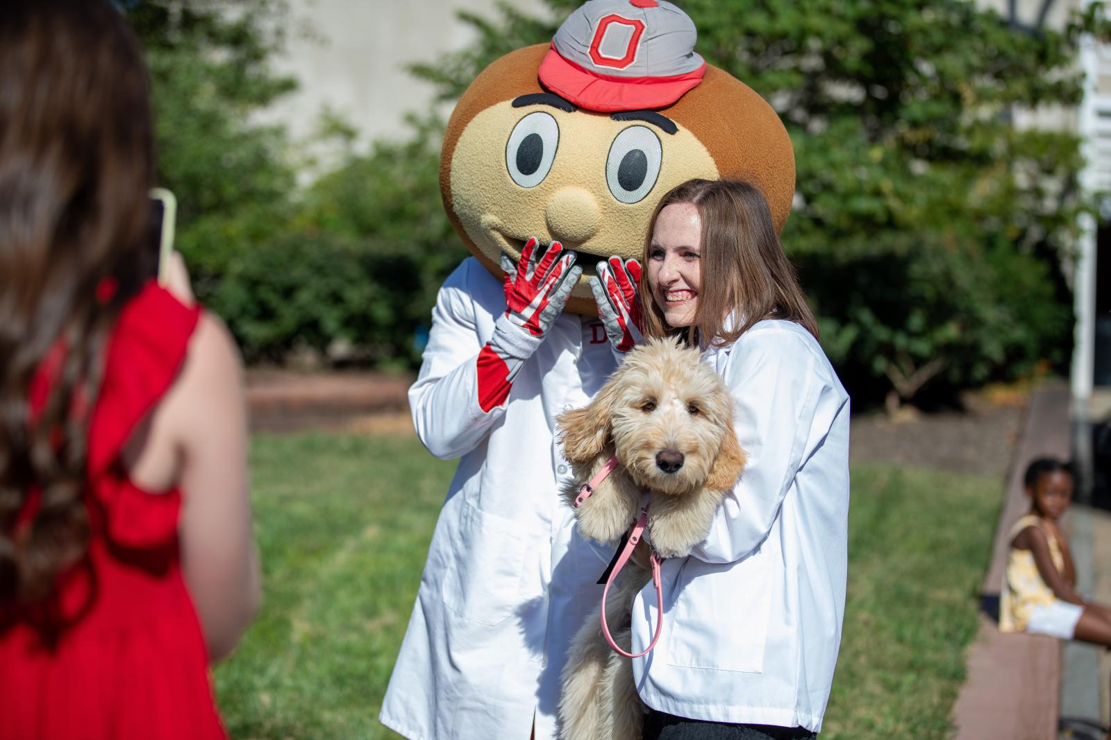 Kaylee and Springer posing with Brutus at White Coat