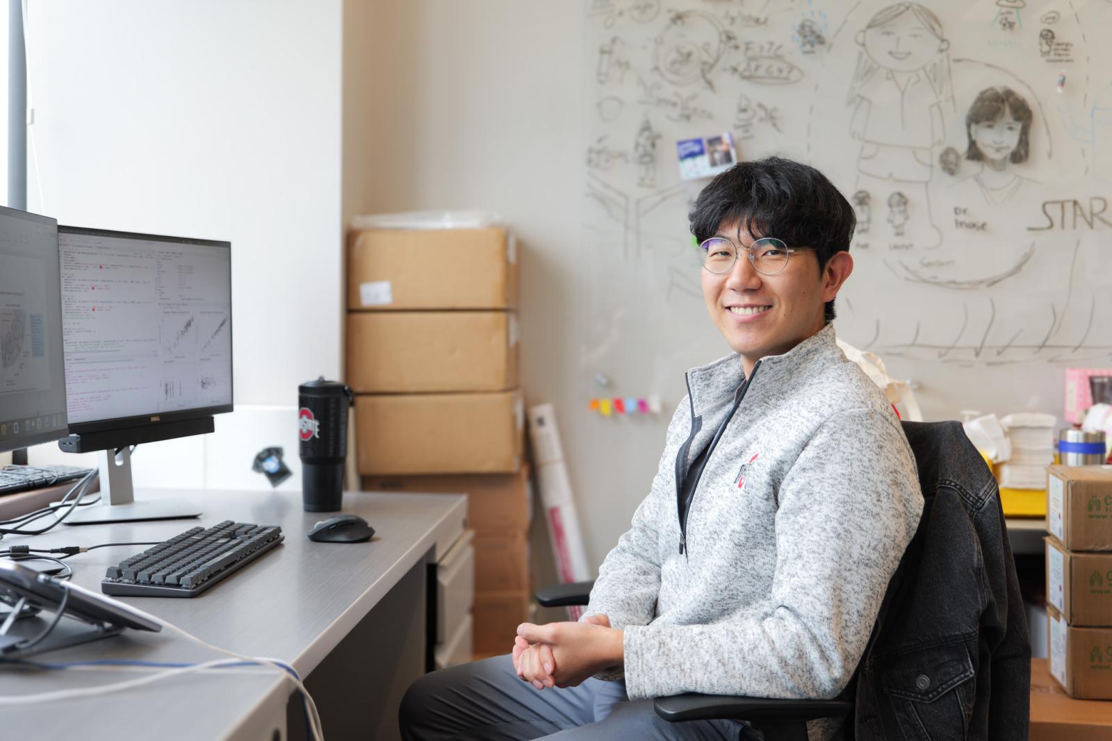 Jin Gyu Kim at his computer in the Phelps-Coss Lab