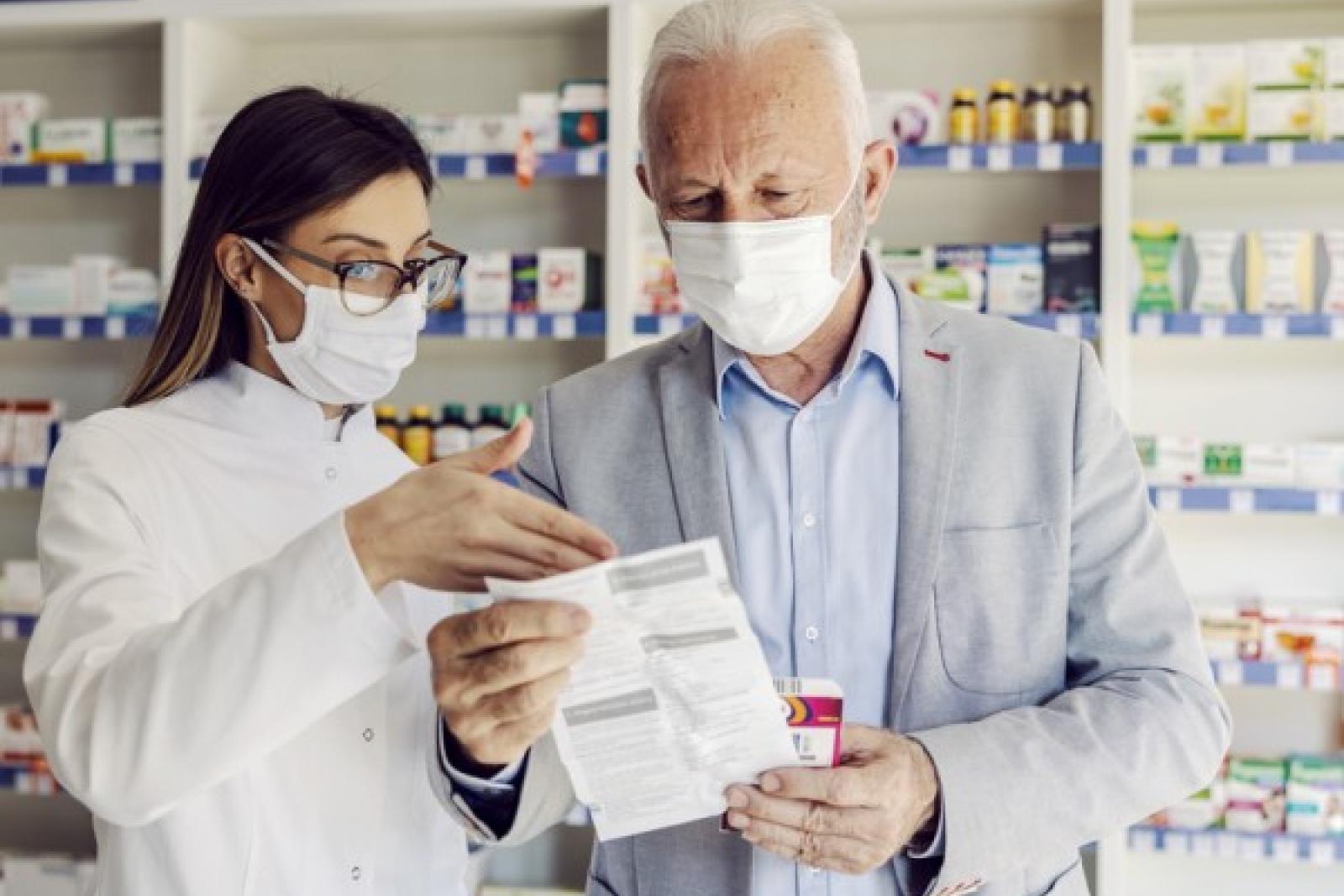 Pharmacist helping patient understand medication
