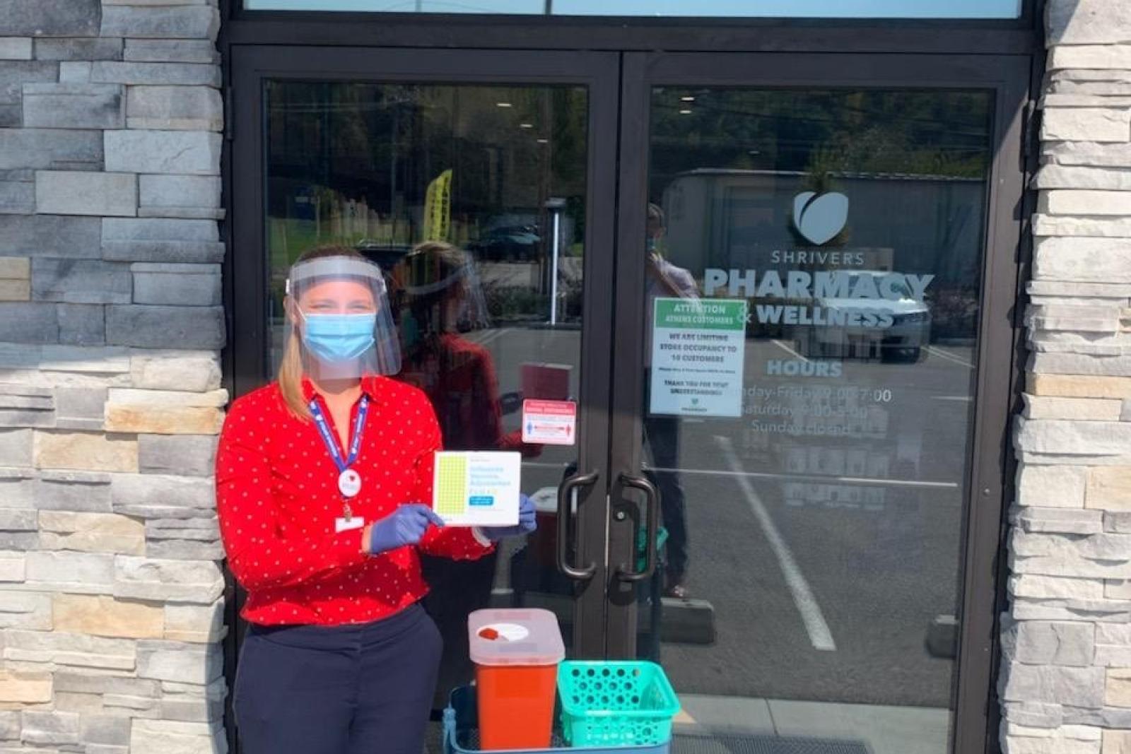 Becca Lahrman holding vaccines